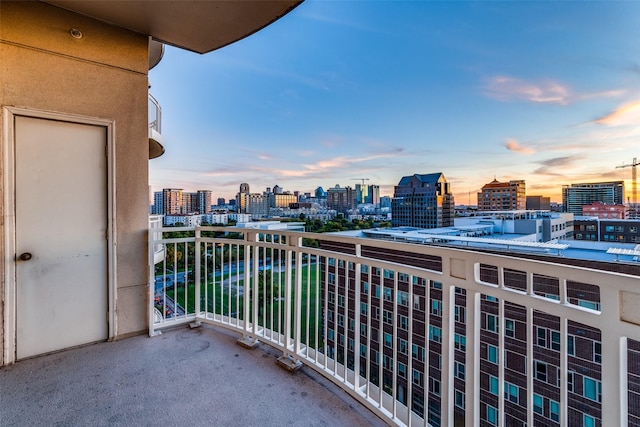 view of balcony at dusk