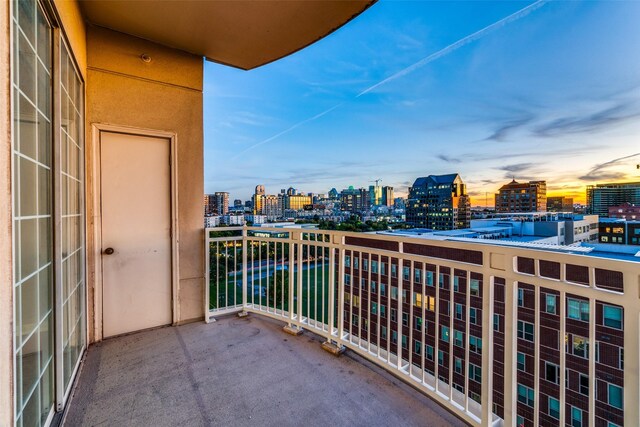 view of balcony at dusk