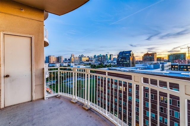 view of balcony at dusk