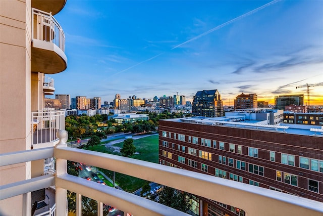 view of balcony at dusk