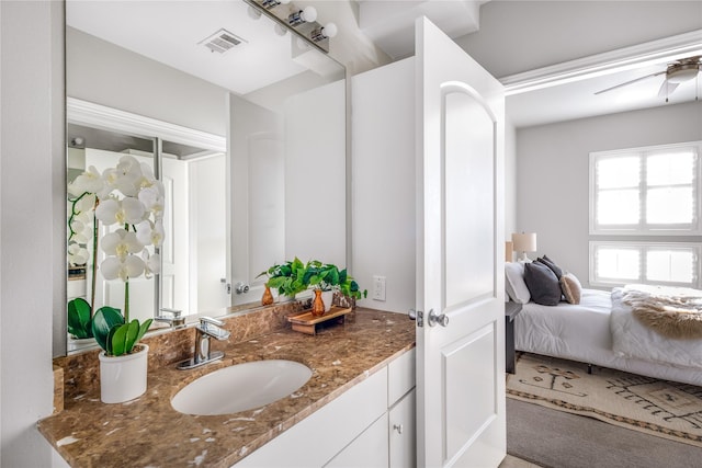 bathroom with ceiling fan and vanity