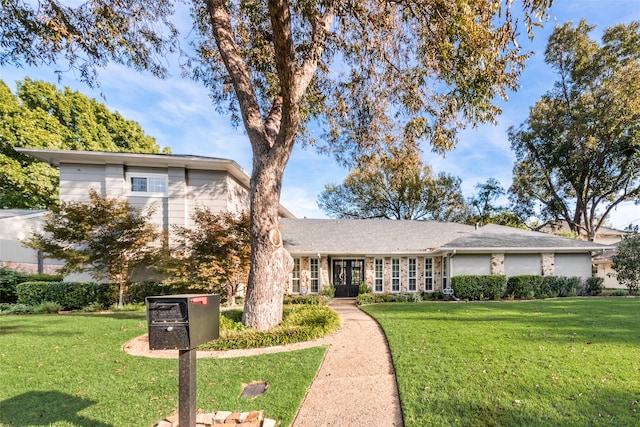 view of front of property with a front lawn