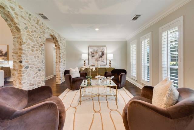 living room featuring hardwood / wood-style floors and crown molding