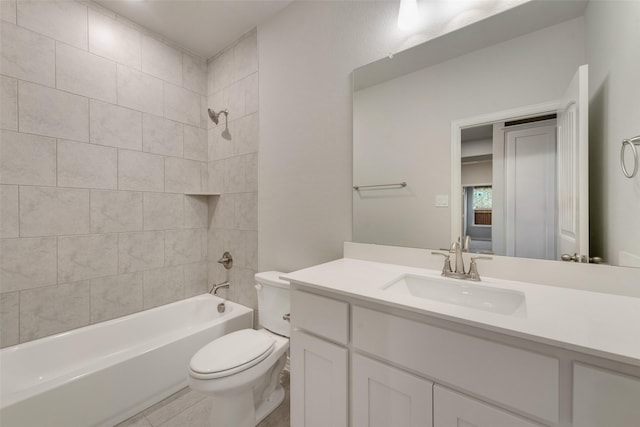 full bathroom featuring vanity, toilet, tiled shower / bath combo, and tile patterned flooring