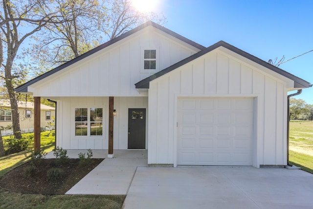 modern farmhouse style home featuring a garage