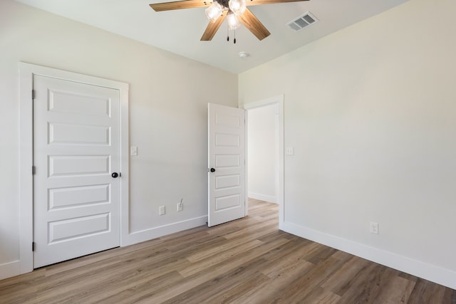 unfurnished bedroom featuring light hardwood / wood-style flooring and ceiling fan