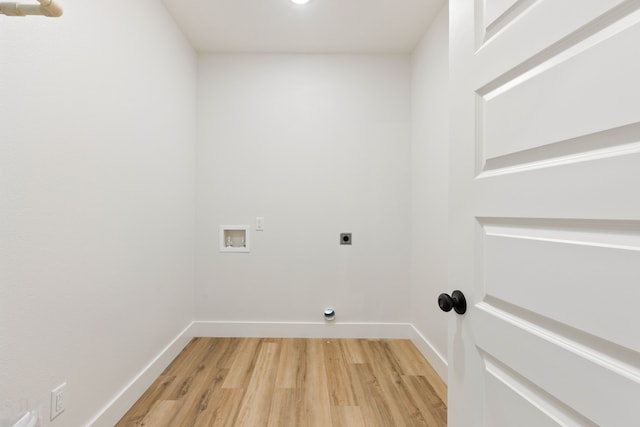 clothes washing area with hookup for an electric dryer, wood-type flooring, and hookup for a washing machine