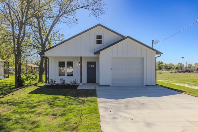 modern farmhouse style home featuring a front yard and a garage