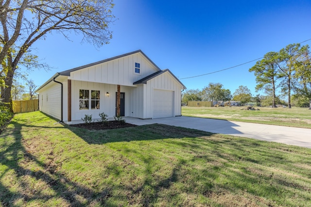 view of front of home featuring a garage and a front lawn