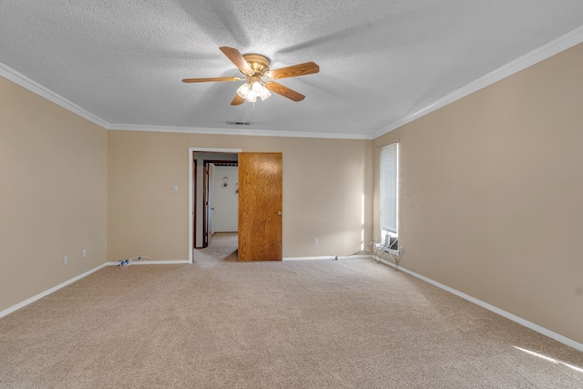 carpeted empty room with ceiling fan, a textured ceiling, and ornamental molding