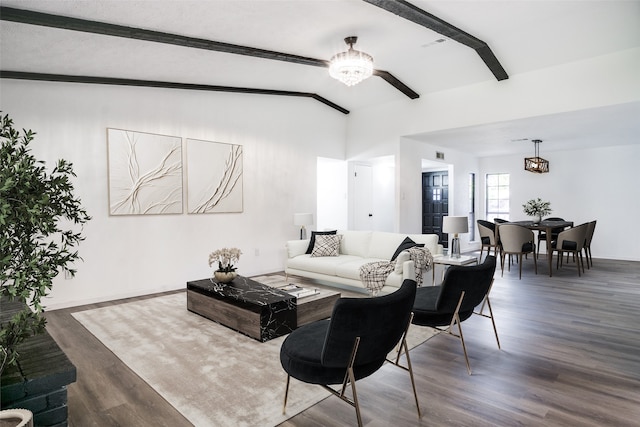 living room featuring vaulted ceiling with beams, dark hardwood / wood-style floors, and a notable chandelier