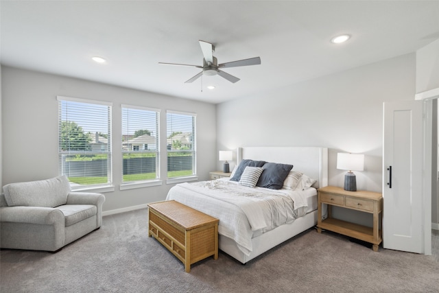 carpeted bedroom featuring ceiling fan