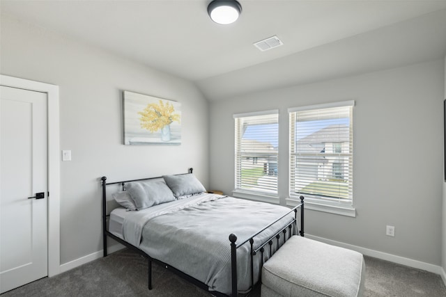 carpeted bedroom featuring lofted ceiling