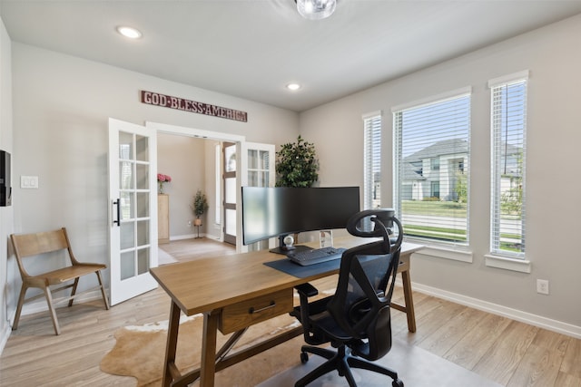 office featuring french doors and light hardwood / wood-style flooring