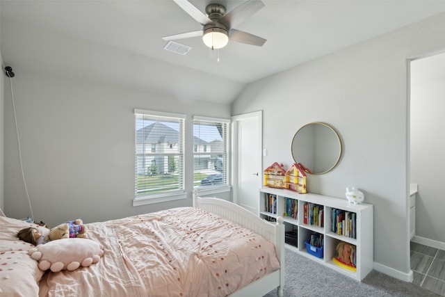 carpeted bedroom featuring ceiling fan and vaulted ceiling