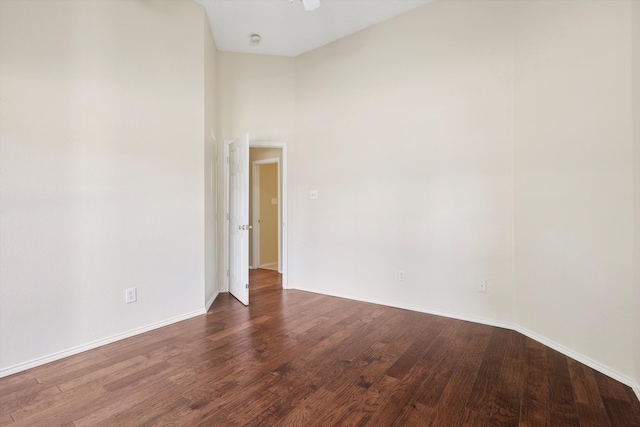 empty room featuring dark hardwood / wood-style flooring