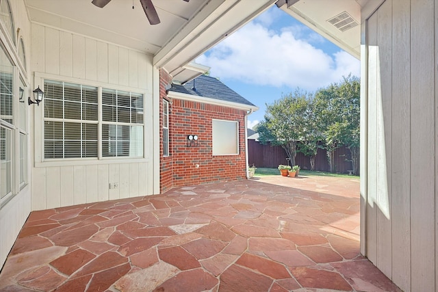 view of patio featuring ceiling fan