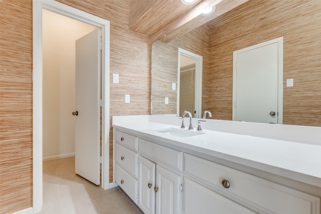 bathroom with tile patterned flooring and vanity