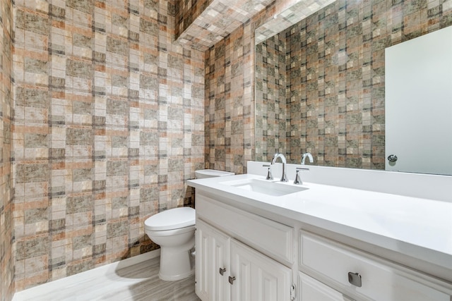 half bath with vanity and toilet