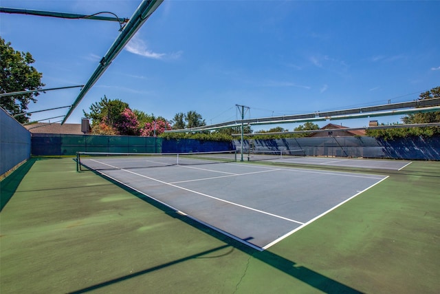 view of sport court with fence