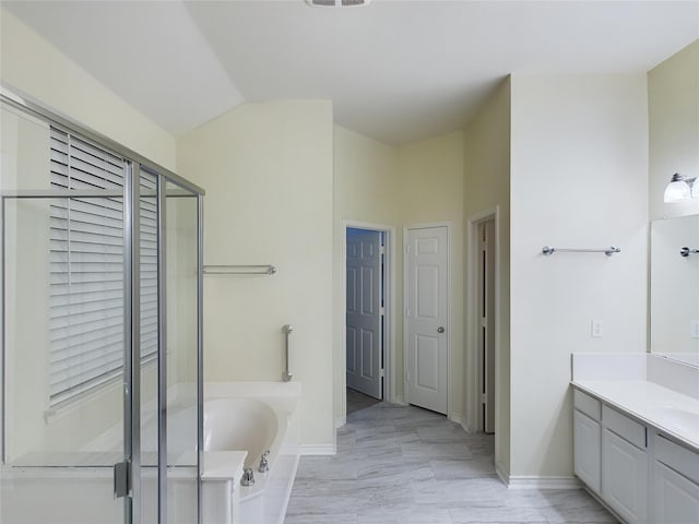 bathroom featuring independent shower and bath and vanity