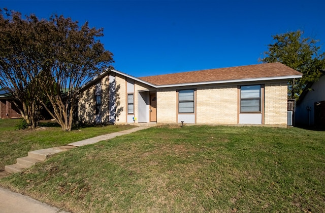 ranch-style home featuring a front yard