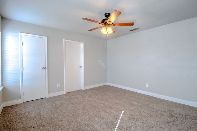 unfurnished bedroom featuring carpet and ceiling fan