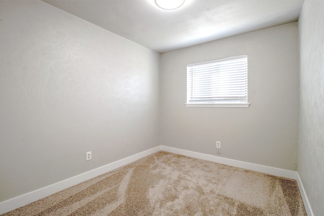 empty room featuring carpet flooring