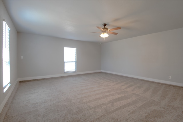 carpeted empty room with ceiling fan