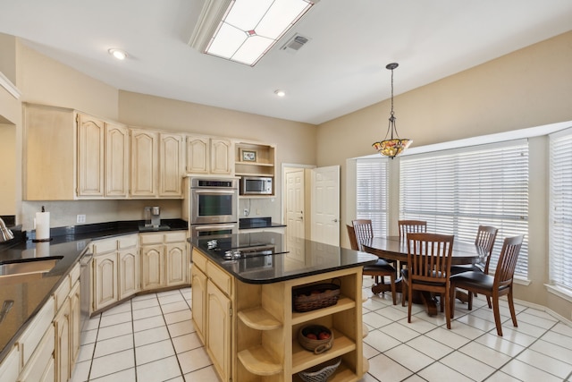 kitchen with light tile patterned flooring, light brown cabinets, appliances with stainless steel finishes, decorative light fixtures, and a kitchen island