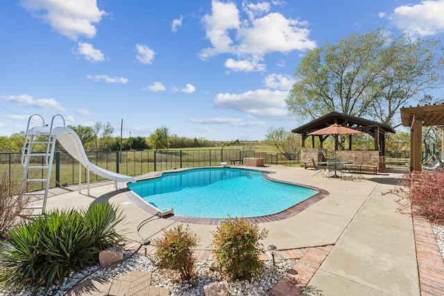 view of pool with a gazebo, a patio, a diving board, and a water slide