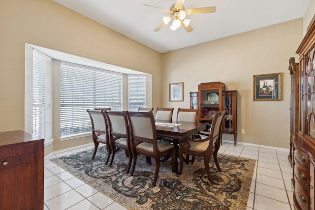 tiled dining area featuring ceiling fan