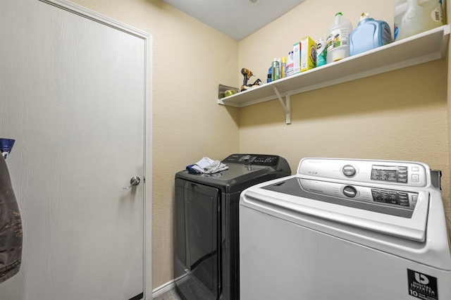 laundry area featuring washing machine and clothes dryer