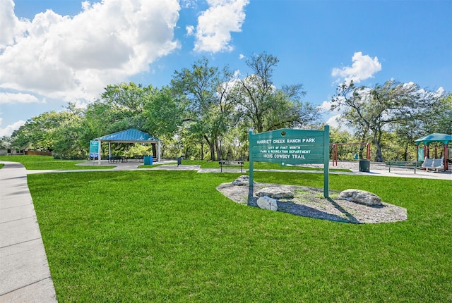 surrounding community featuring a gazebo, a lawn, and a playground