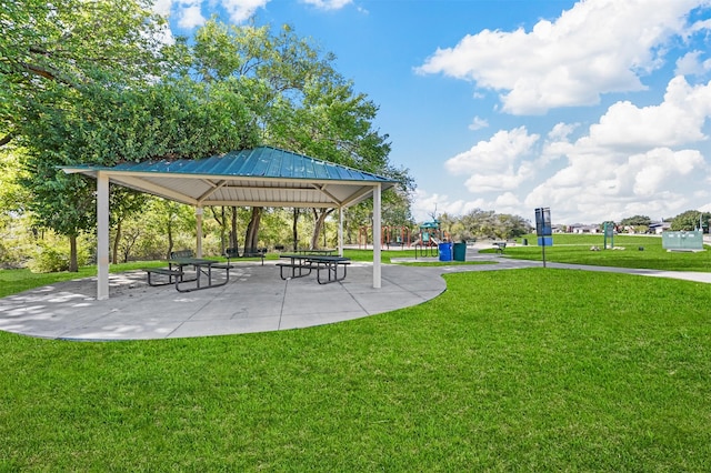 surrounding community featuring a lawn, a playground, and a gazebo