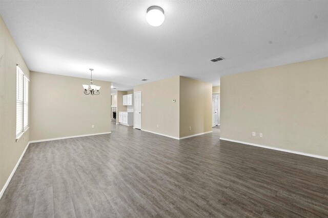 living room featuring a textured ceiling and light wood-type flooring