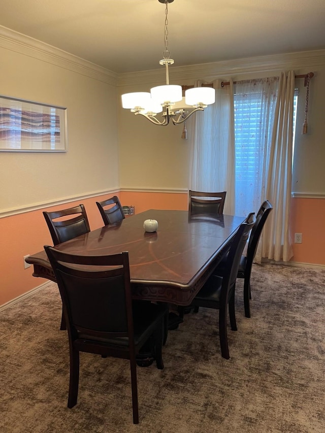 dining area with dark carpet, crown molding, and an inviting chandelier