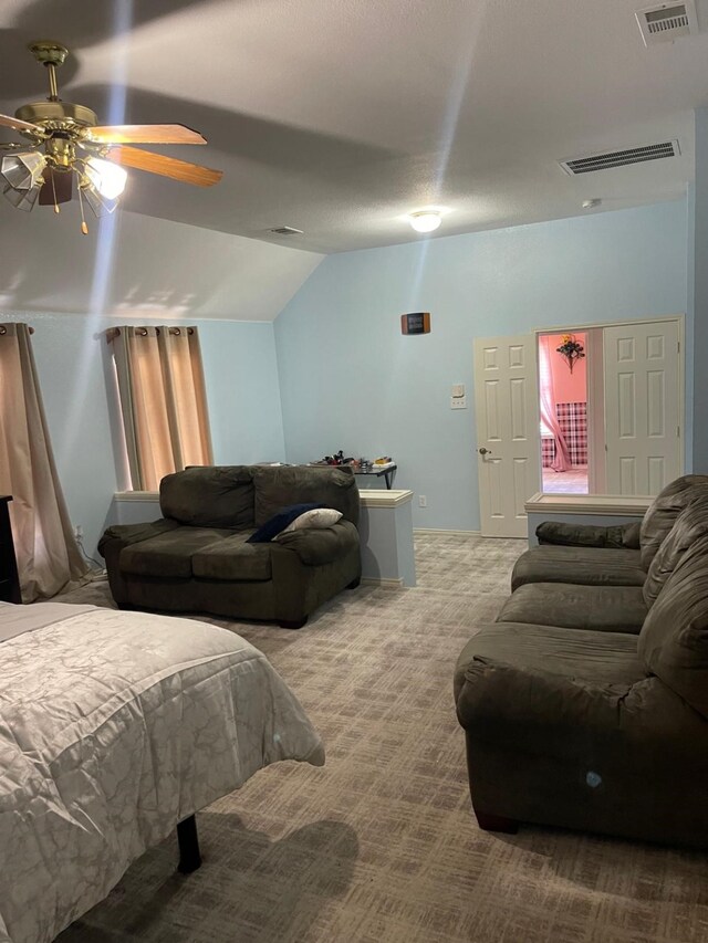 bedroom featuring carpet flooring, ceiling fan, and lofted ceiling