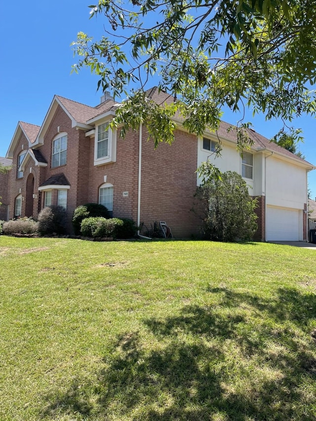 view of home's exterior with a lawn and a garage