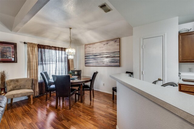 dining room featuring a chandelier and dark hardwood / wood-style floors