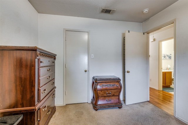 bedroom with light carpet