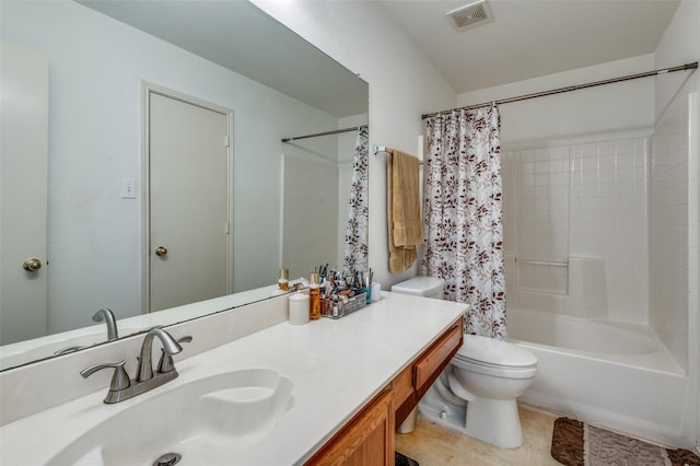 full bathroom featuring vanity, shower / bath combo with shower curtain, tile patterned flooring, and toilet