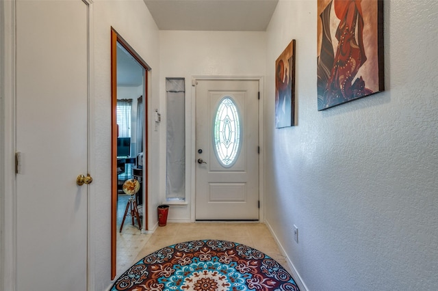 foyer featuring light tile patterned floors