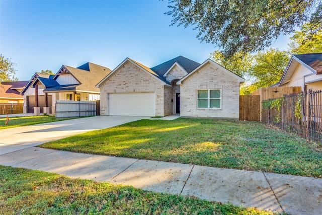 view of front facade with a garage and a front yard