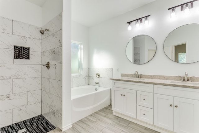 bathroom featuring plus walk in shower and vanity