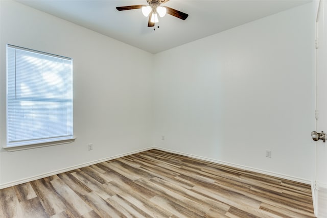 spare room with ceiling fan and light hardwood / wood-style flooring