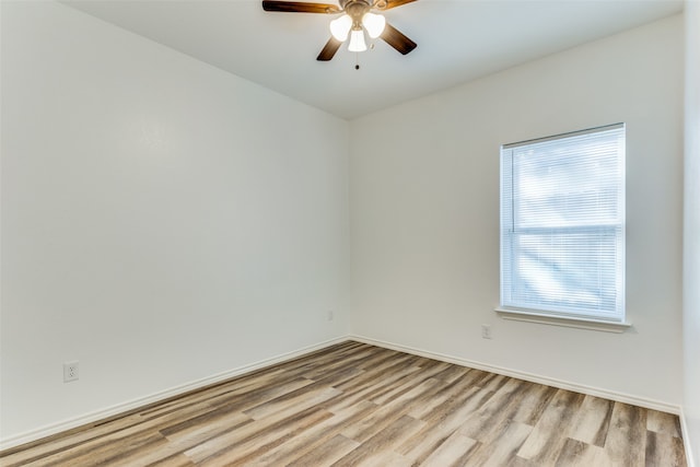 empty room with ceiling fan and light wood-type flooring