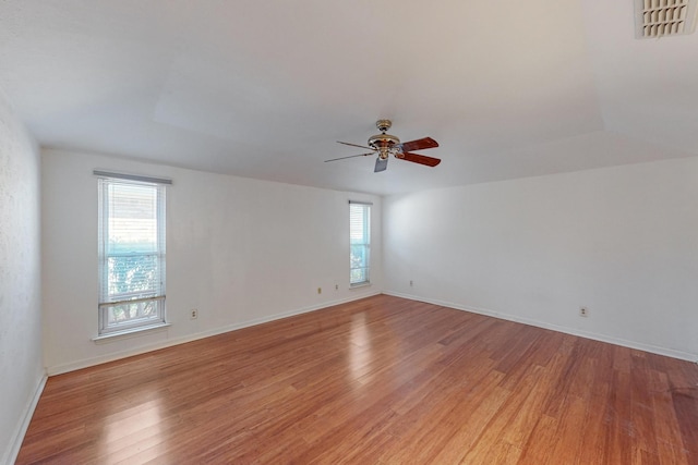 unfurnished room featuring hardwood / wood-style floors and ceiling fan