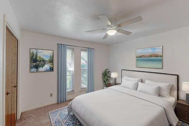 bedroom featuring a textured ceiling, a closet, and ceiling fan