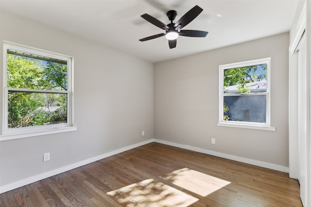 unfurnished room featuring hardwood / wood-style floors and ceiling fan